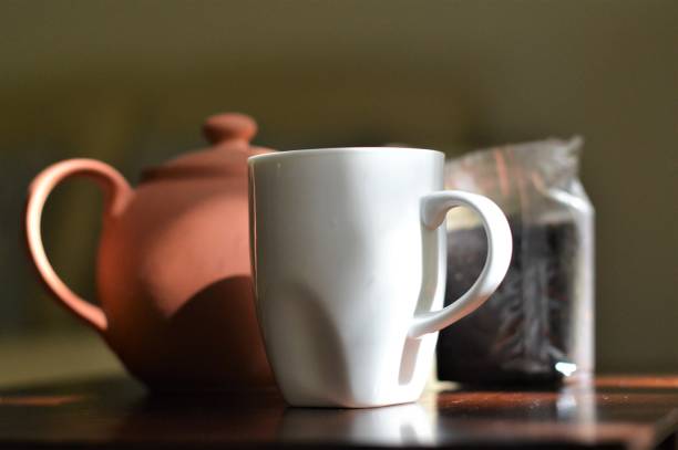 istock Mug, teapot and tea leaves 678531514