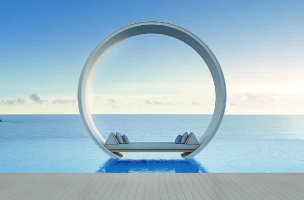 диванная кровать и бассейн в роскошном отеле с видом на море - swimming pool infinity pool patio sea стоковые фото и изображения