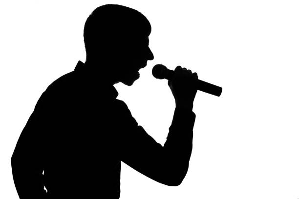 istock Silhouette of a man screaming into a microphone 678535236
