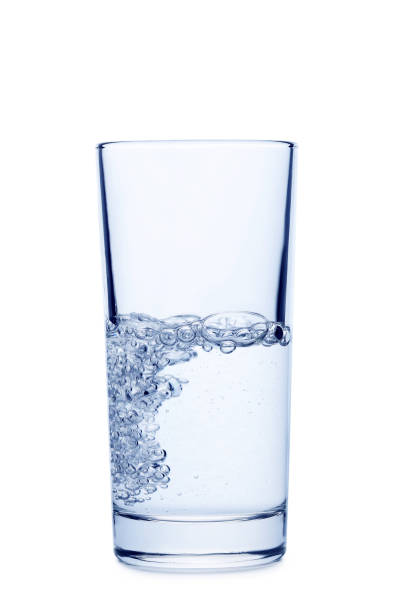 istock Water pouring in glass isolated on a white 678535376