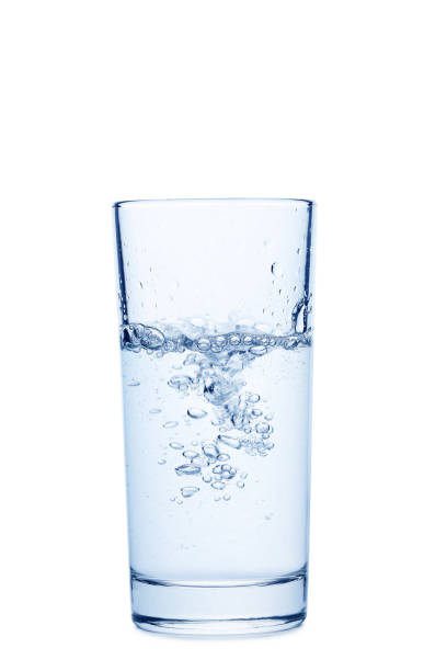 istock Water pouring in glass isolated on a white 678535494