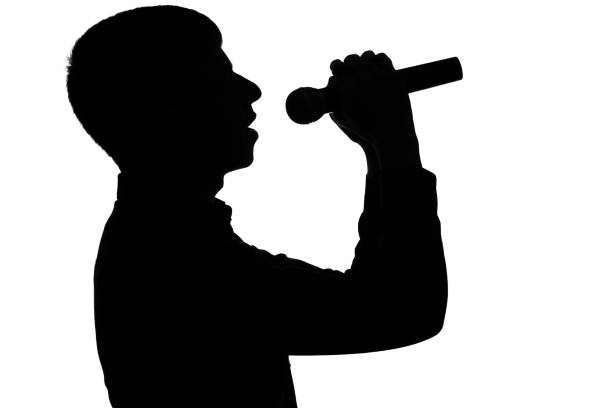 istock Silhouette of a singer on an isolated background 678535702