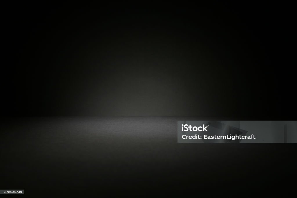 Dark Background Table Top Copy Space Shot of a table top lit very subtly to keep dark and grey, ideal for use as a background image that can be changed in colour to meet needs of designer Backgrounds Stock Photo
