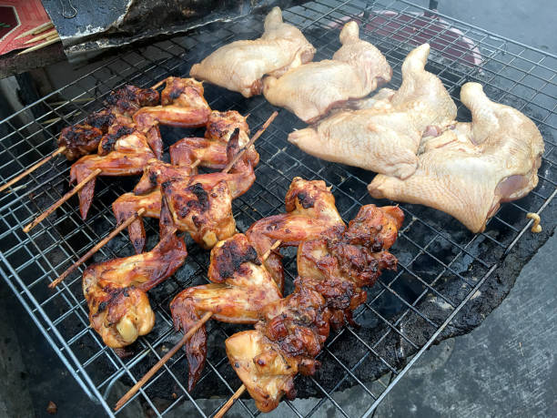 istock hot grill chicken wing BBQ grilled on fire Asian, 678536138