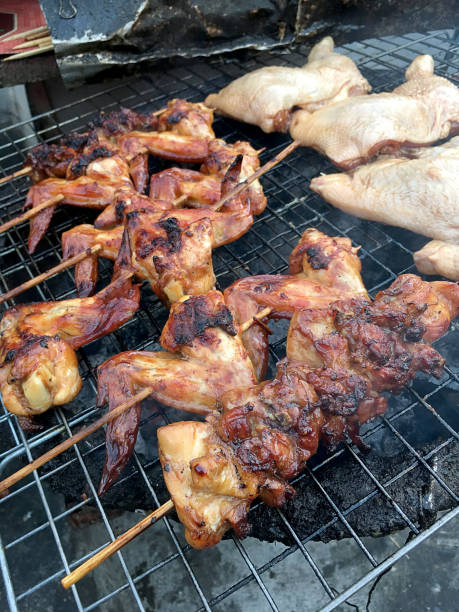 istock hot grill chicken wing BBQ grilled on fire Asian, 678543070
