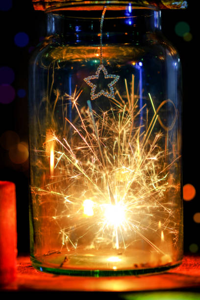 istock sparklers in Glass jar on abstract circular bokeh  background. 678545326