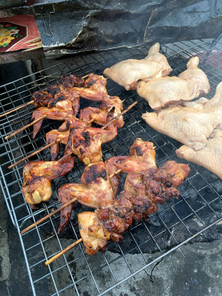 istock hot grill chicken wing BBQ grilled on fire Asian, 678545928