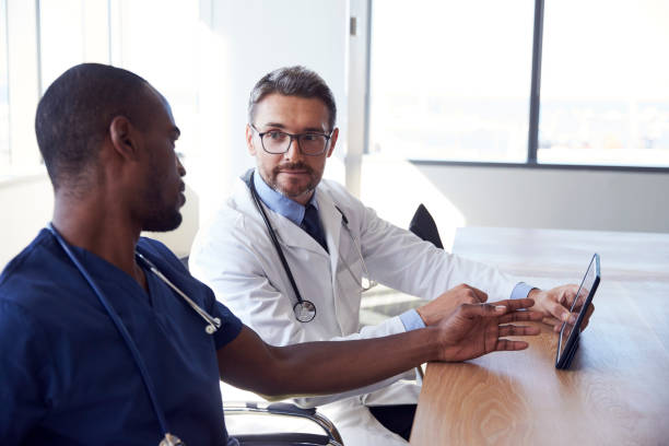istock Hospital Staff Meeting And Review Notes On Digital Tablet 678551514