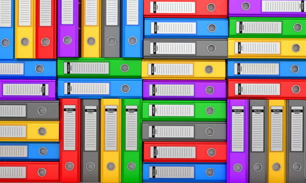 istock Many colorful folders stacked in a row. Ring binders. 3D illustration. 678554418