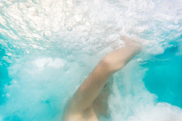 istock Human drowning into the water at awimming pool 678555332
