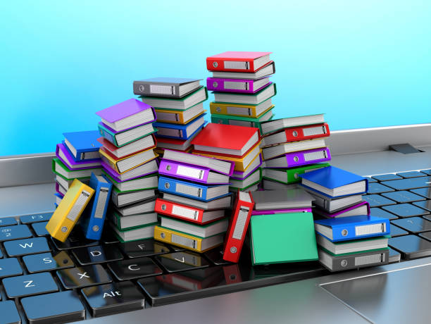 istock Many colorful folders stacked in a row on a laptop. Ring binders. 3D illustration. 678555348