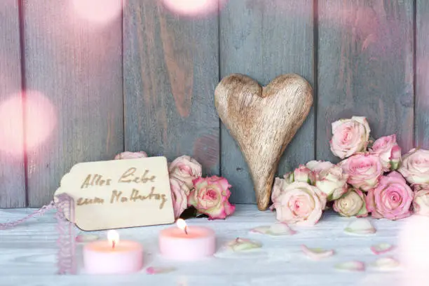 Mothers day greetings in vintage style with tender pink bokeh