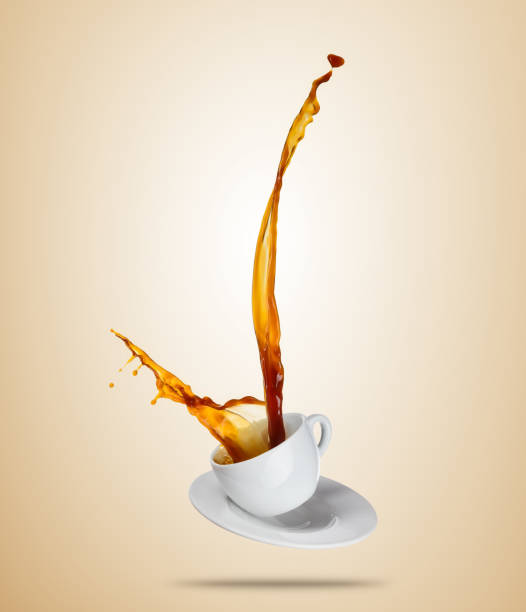 istock Porcelaine white cup with splashing coffee or tea liquid separated on brown background. 678557708