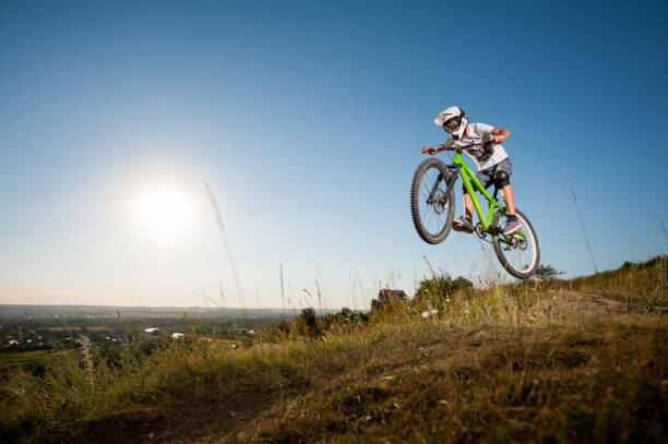 istock Cyclist riding downhill on mountain bike on the hill 678558802