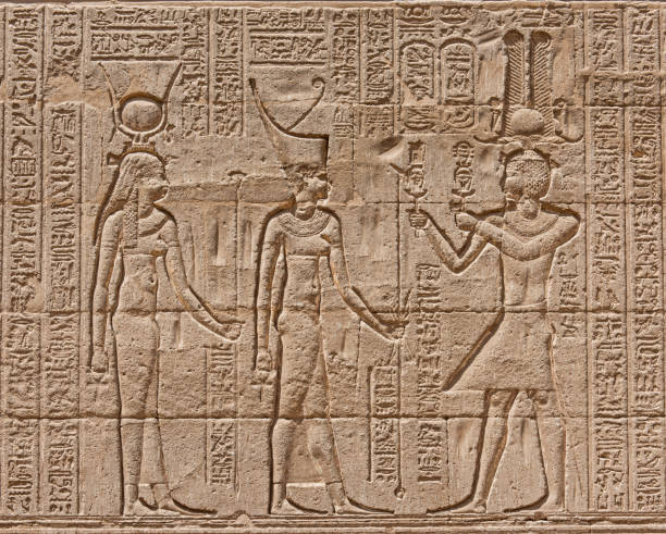 istock Hieroglyphic carvings on an ancient egyptian temple wall 678573392