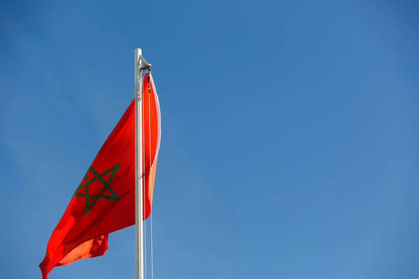 istock National flag of Morocco on a flagpole 678578360
