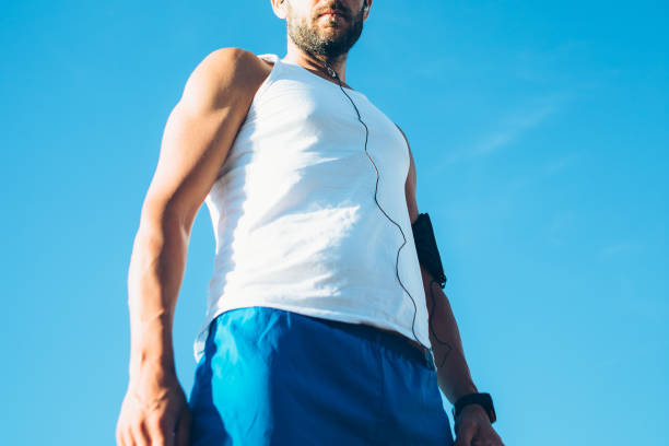 istock Fit man with earphones 678583194