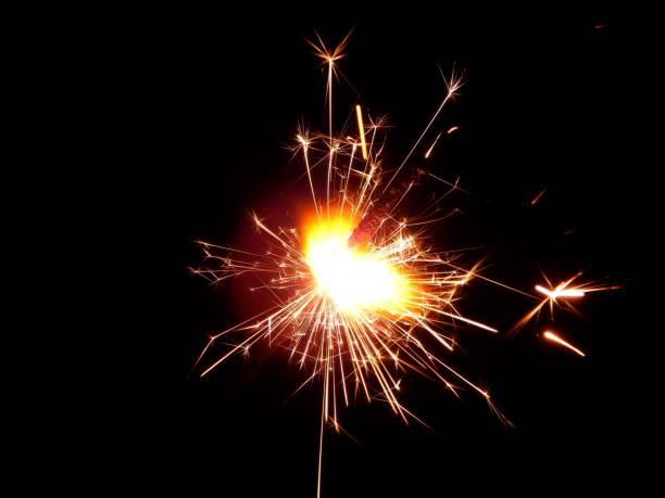 istock Bright sparklers on black background closeup 678587246