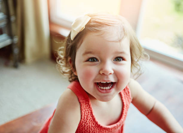 Being young means enjoying days full of fun Shot of an adorable little girl at home babies only photos stock pictures, royalty-free photos & images