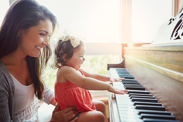 istock Piano lessons with Mom are always fun 678589648