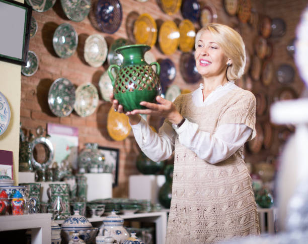 istock Female posing with ceramic tableware at supermarket 678595522