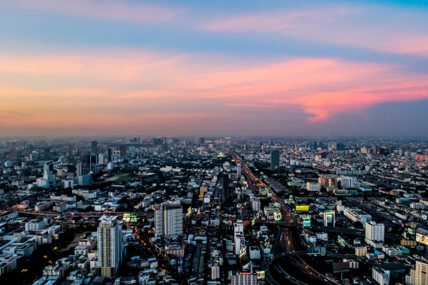 istock sunset megapolis Beautiful cityscape with top view on skyscrapers 678601414