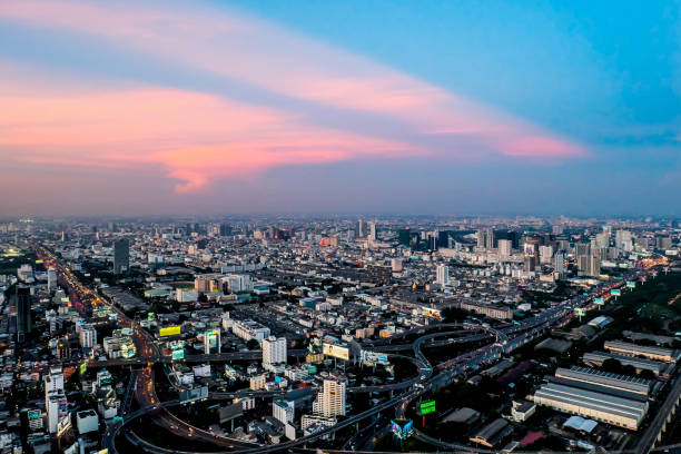 istock sunset megapolis Beautiful cityscape with top view on skyscrapers 678601594
