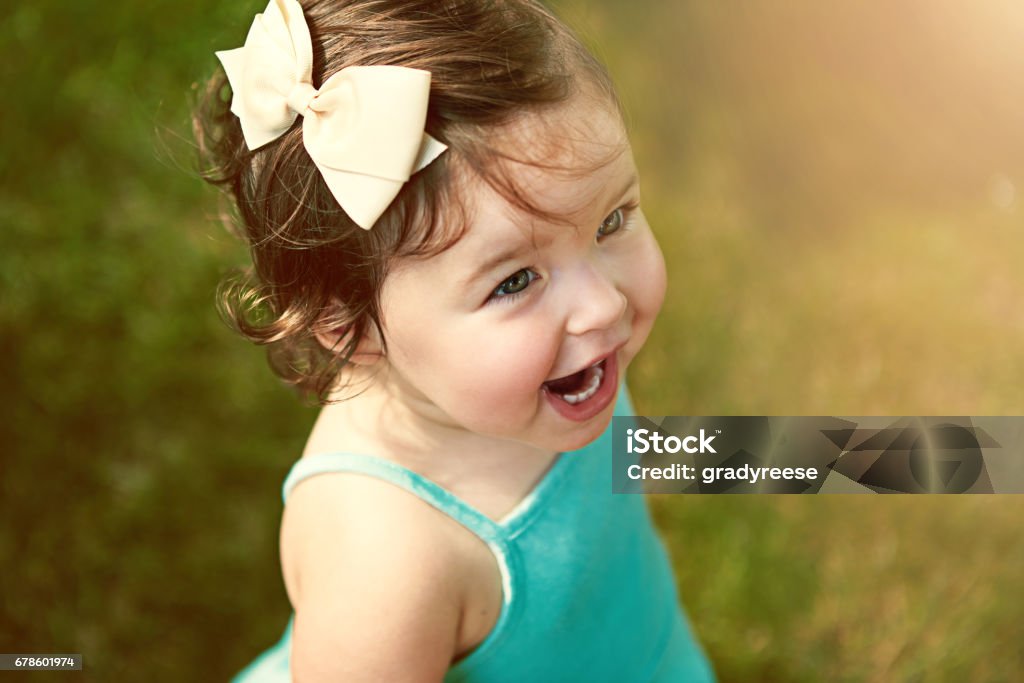 She's adorable as can be High angle shot of an adorable little girl outside Smiling Stock Photo