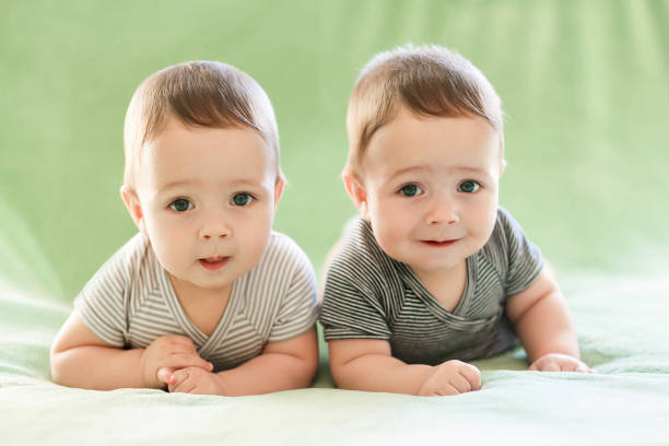 istock Newborn twins boys are lying on the bed 678602858