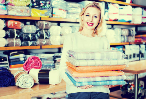 istock Young female customer boasting purchased home textiles 678604842