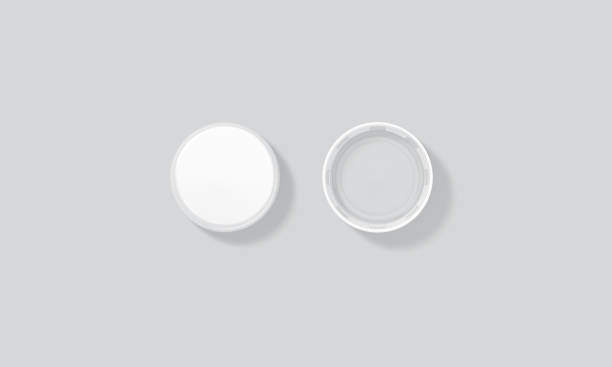Blank white plastic bottle caps mock up set isolated, top Blank white plastic bottle caps mock up set isolated, top side view, 3d rendering. Empty mineral water lids mockups. Fizzy pop circle clear cover design template. Soda drink element bottle cap stock pictures, royalty-free photos & images