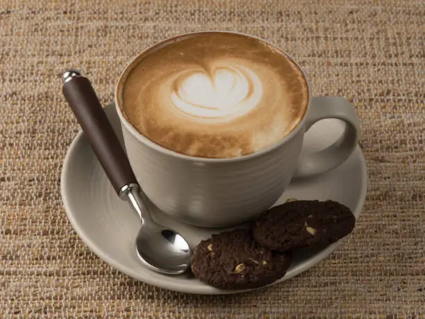 Cappuccino coffee and chocolate cookies.