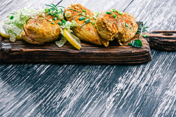 istock Roasted chicken breast on rustic wood 678638864
