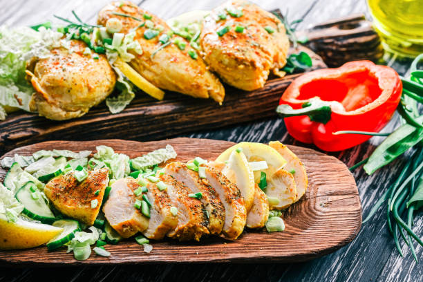 istock Roasted chicken breast on rustic wood 678639310