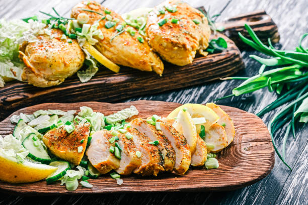 istock Roasted chicken breast on rustic wood 678639410