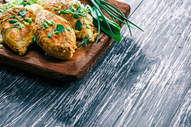 istock Roasted chicken breast on rustic wood 678644380