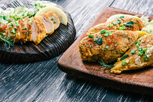 istock Roasted chicken breast on rustic wood 678645390