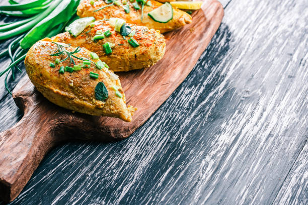 istock Roasted chicken breast on rustic wood 678648794