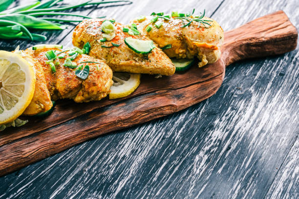 istock Roasted chicken breast on rustic wood 678649048
