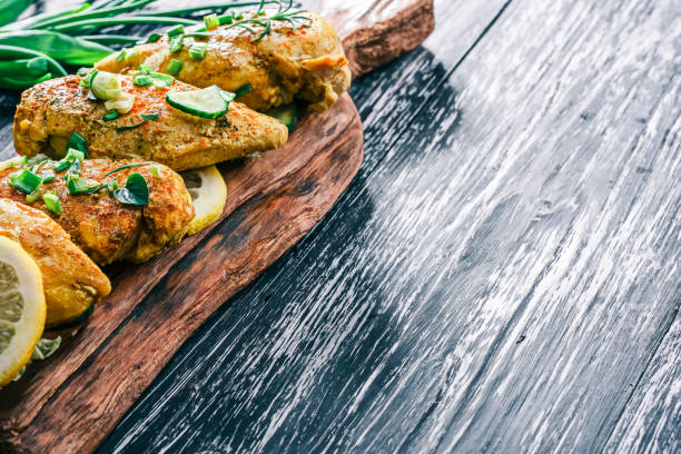 istock Roasted chicken breast on rustic wood 678649062