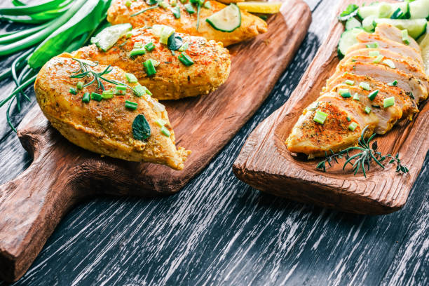 istock Roasted chicken breast on rustic wood 678649072