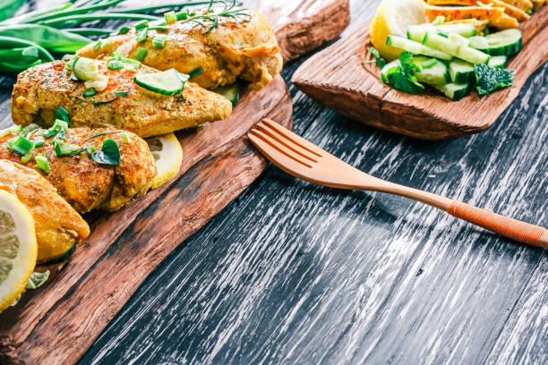 istock Roasted chicken breast on rustic wood 678649280