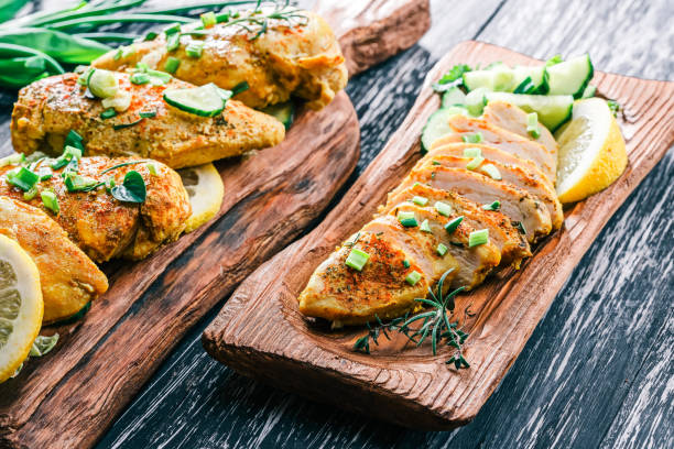 istock Roasted chicken breast on rustic wood 678649386