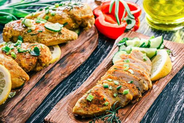 istock Roasted chicken breast on rustic wood 678649506