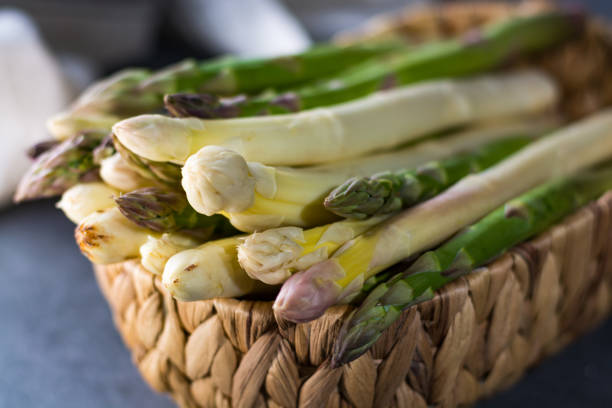 istock Spring season - fresh white and green asparagus 678649610