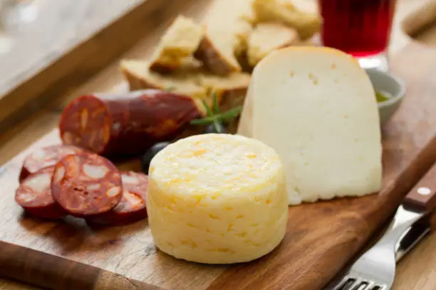 cheese with smoked sausage, bread and red wine