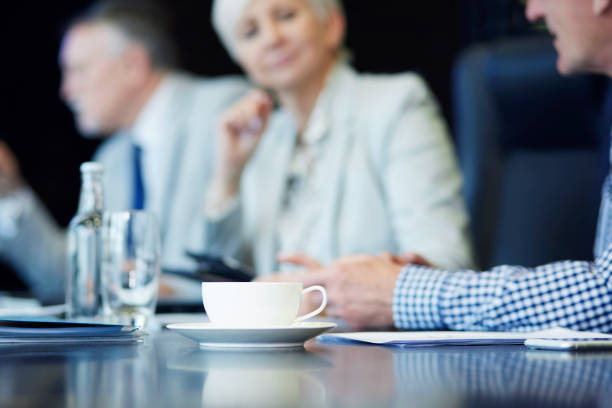 istock Cup of coffee on the conference table 678653112