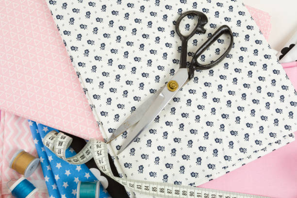 istock cotton fabric material and tailor measurement tape 678653316