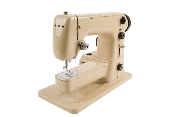 istock Old vintage sewing machine isolated on white 678653880