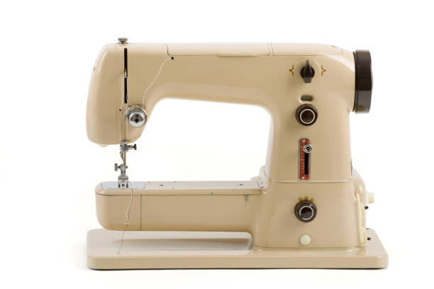 istock Old vintage sewing machine isolated on white 678654004